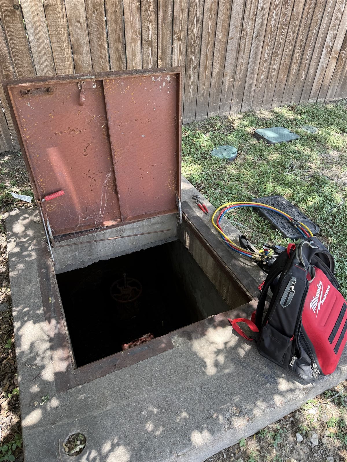 Underground fire line backflow vault serviced by Atlas Backflow in Lewisville, TX